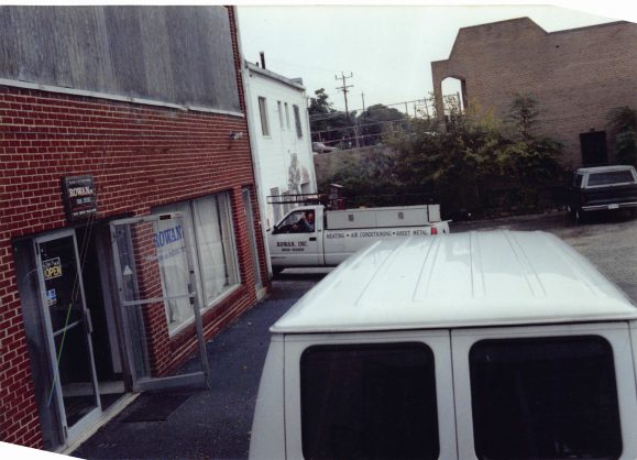 The shop on a workday morning, trucks loaded for the day's calls.